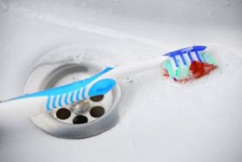 Toothbrush showing signs of bloody gums