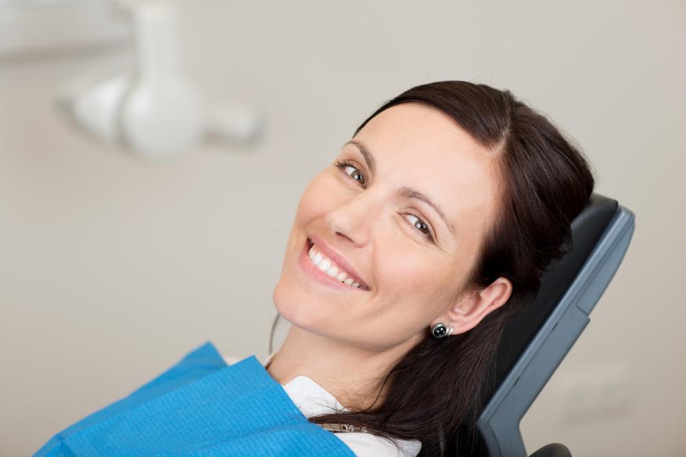 Woman in dental office smiling