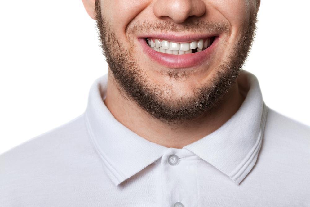 Man in white shirt smiling